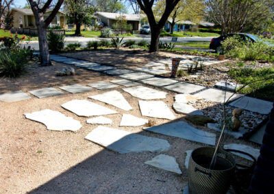 This image depicts the limestone patio made up of several broken limestone pavers placed in a lovely pattern on the crushed granite.