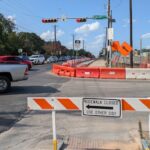 Sidwalk construction impacting traffic on Berkman Dr