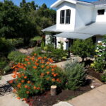 An birds eye view of 5400 Wellington where you'll find the colorful front yard on full display.