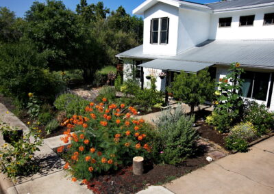 An birds eye view of 5400 Wellington where you'll find the colorful front yard on full display.