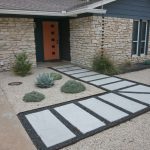 Front Walk, white stone blocks in gray gravel leading to Orange Door