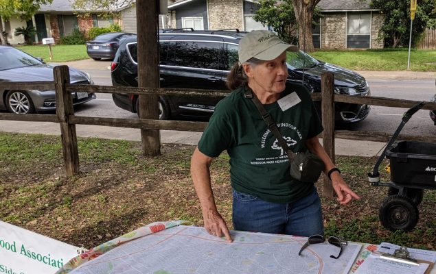 Jeanette Swenson explaining neighborhood mobility concerns and eliciting input from neighbor at the Roots and Wings festival.